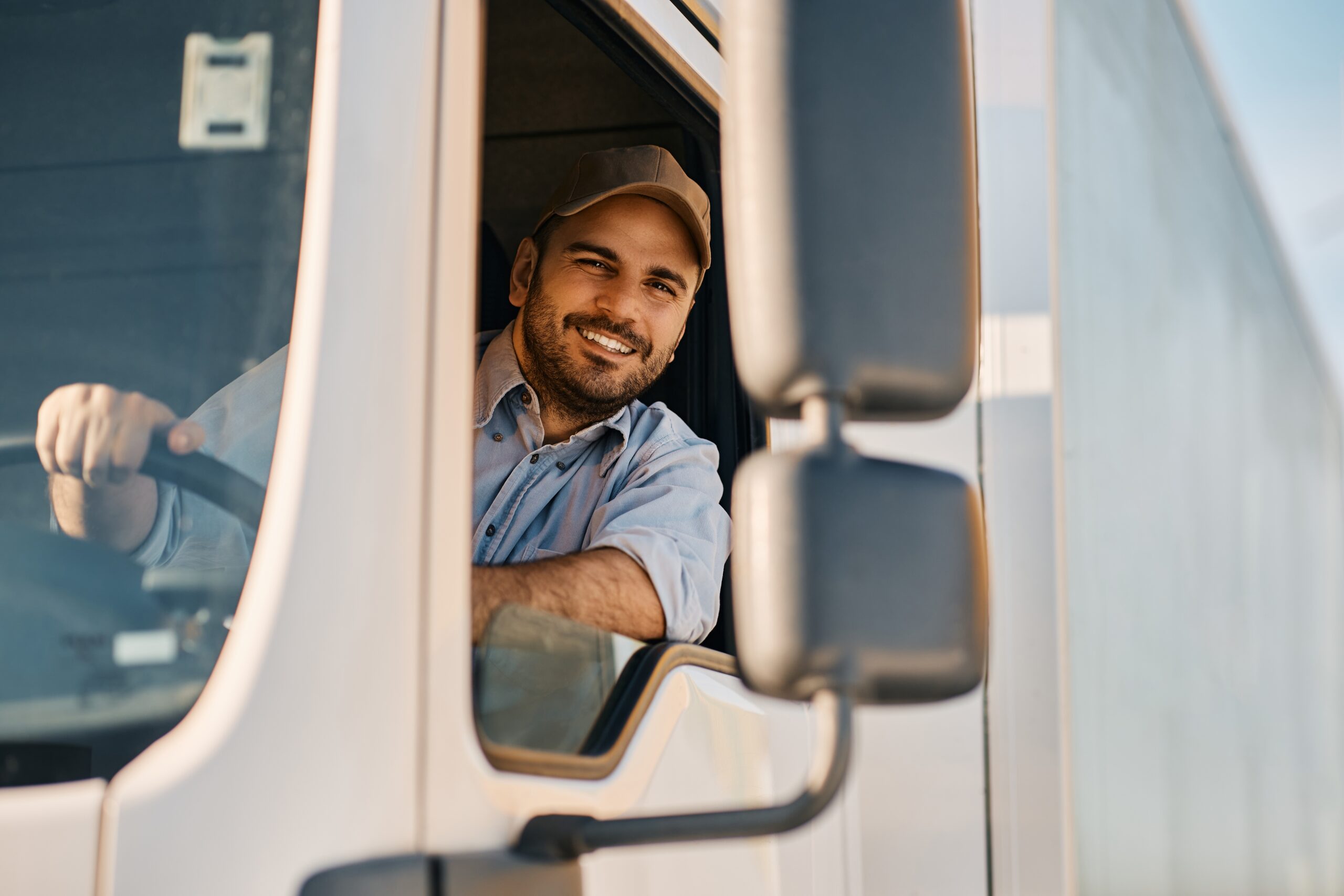 happy man driving truck