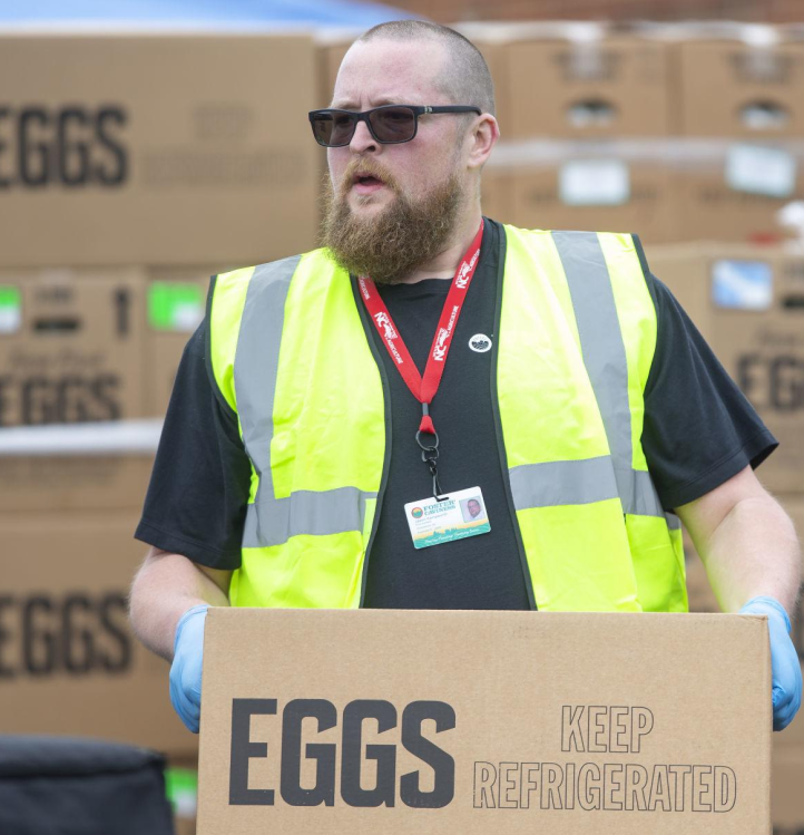 Man carrying eggs in box