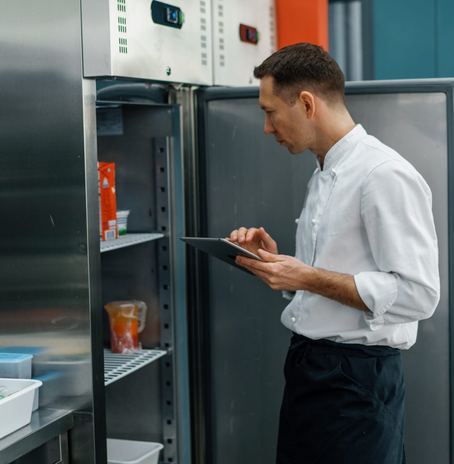 Man checking contents of kitchen fridge